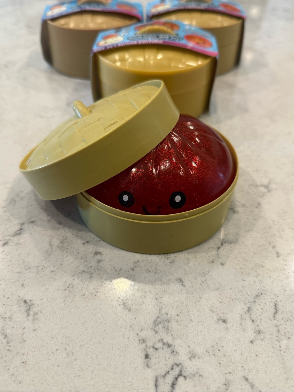 Red Dumpling Squishy in Yellow Bao Container